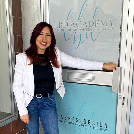 Blanca at the front door of Lashes by Design and LBD Academy