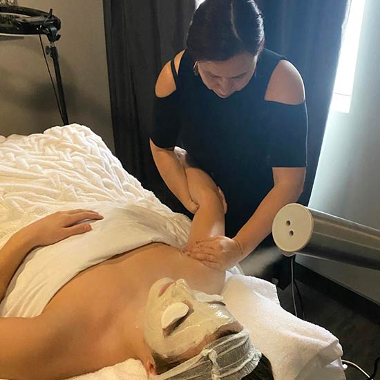 Blanca giving a massage during a facial